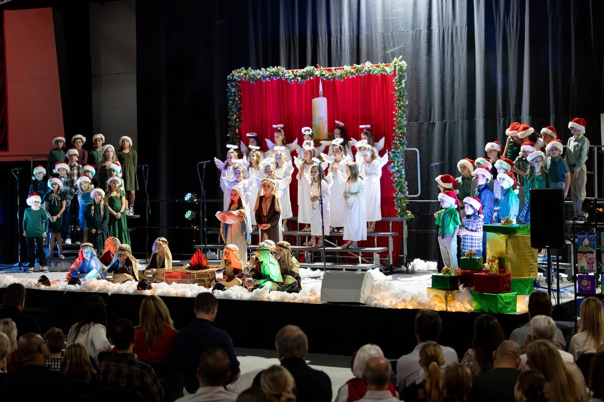 Students performing together on stage during a year-end music moment
